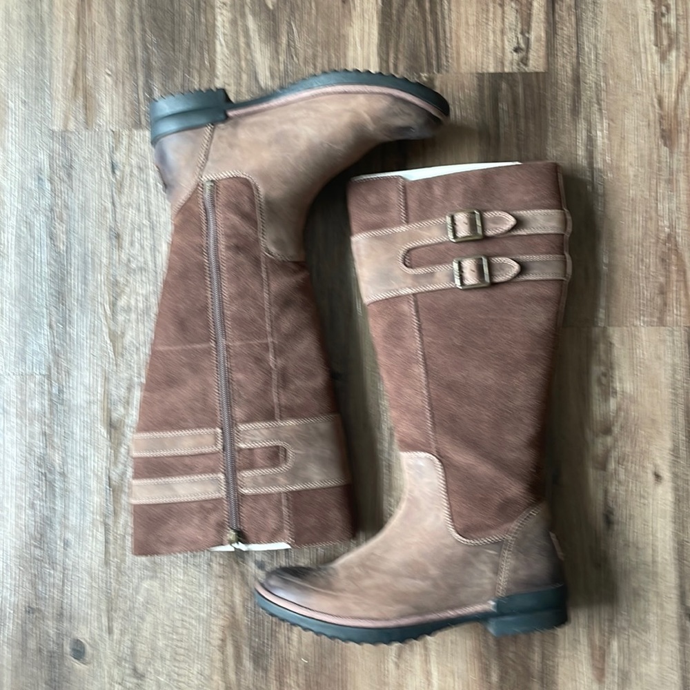Brown water resistant rubber sole winter Ugg Boot.
